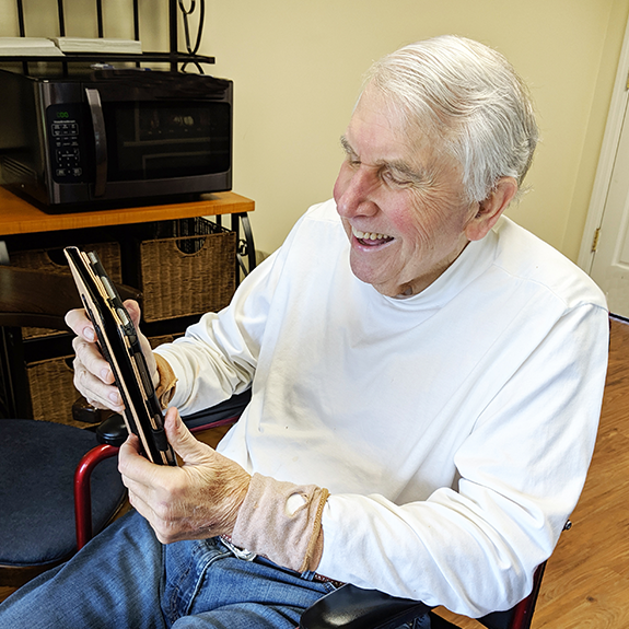 a man reading on an ipad