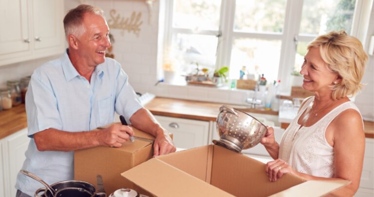 two people unpacking kitchen supplies