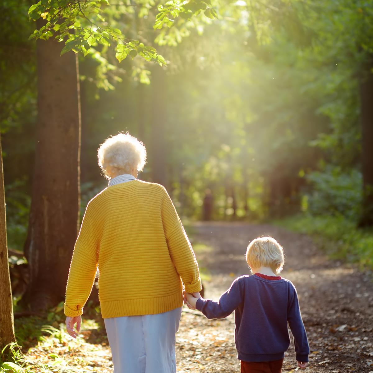 a woman walking with her grandson